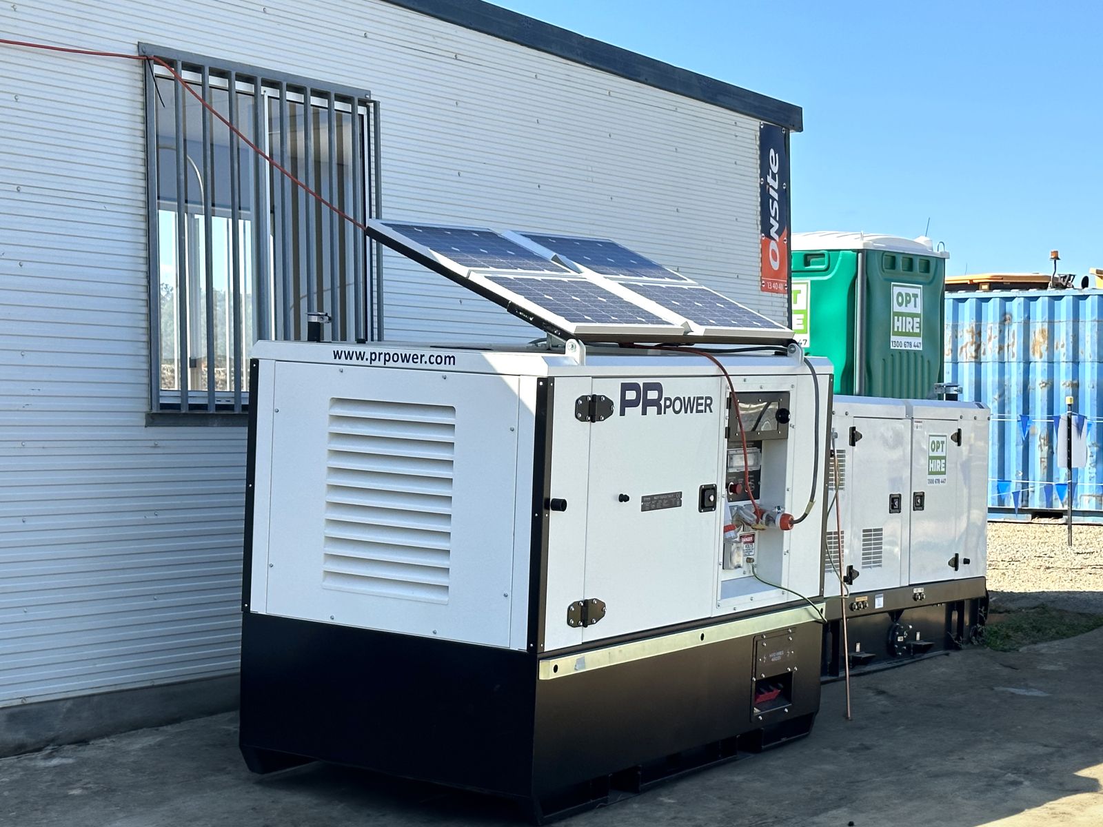Solar generator with portable building in background