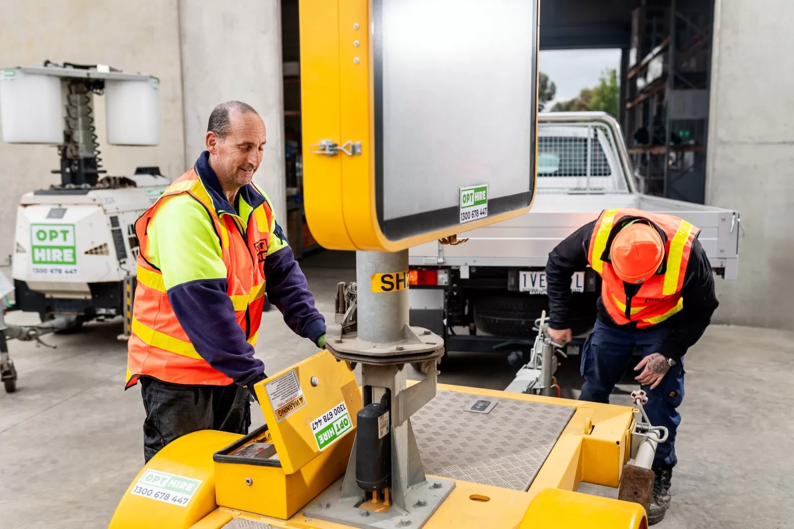 employees working a digital message board
